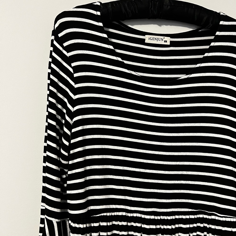 Striped peplum 3/4 sleeve top.